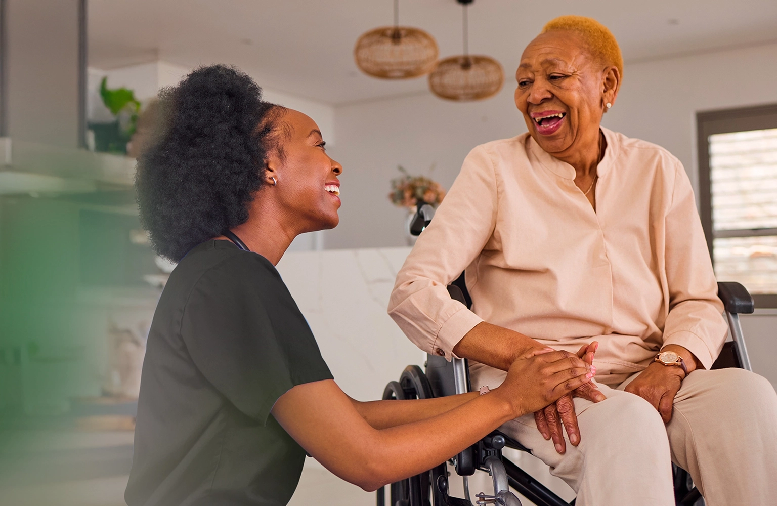 Home healthcare nurse supporting senior woman in wheelchair during an in-home care visit